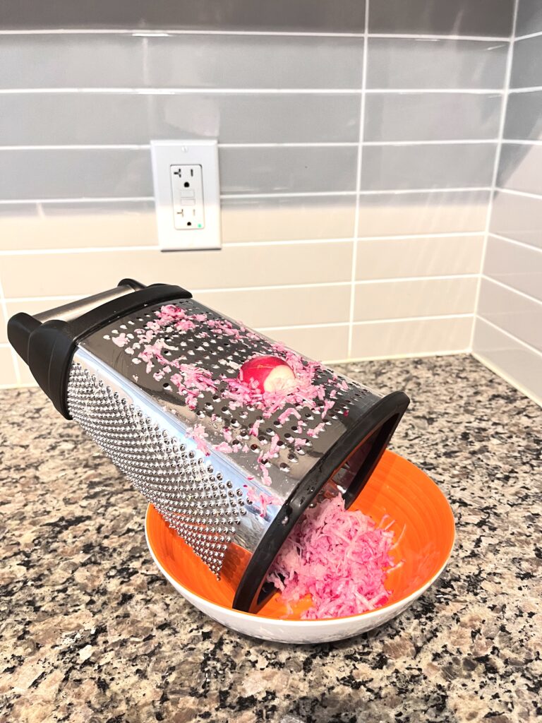 grating radishes for Polish Farmer’s Cheese Spread