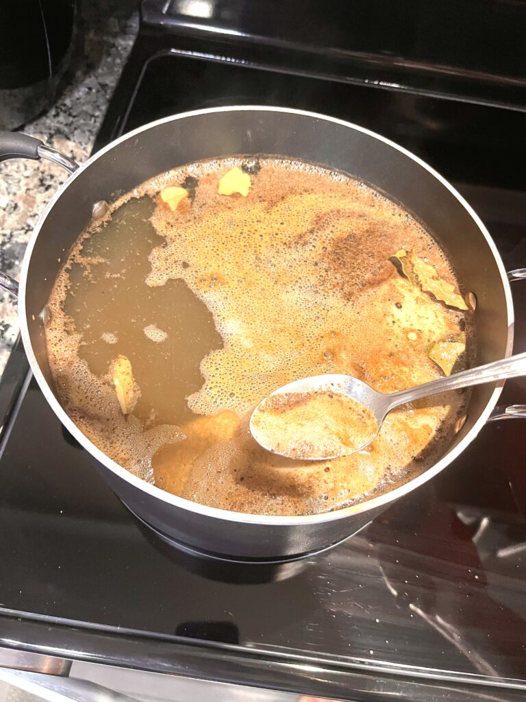 chicken being cooked for Vegetable soup