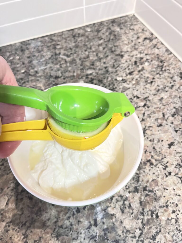 squeezing lemon for Radish Tzatziki Dip